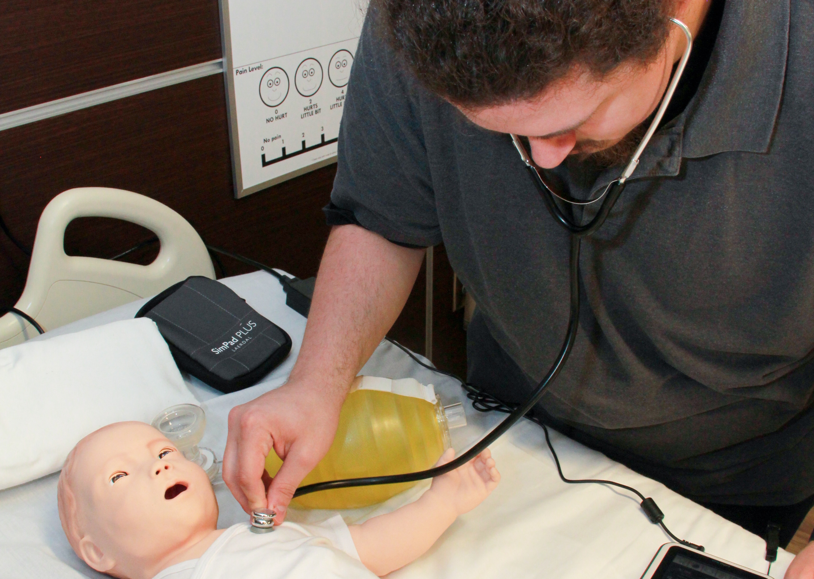 OTC nursing student practicing on SimBaby, a tetherless pediatric simulator.
